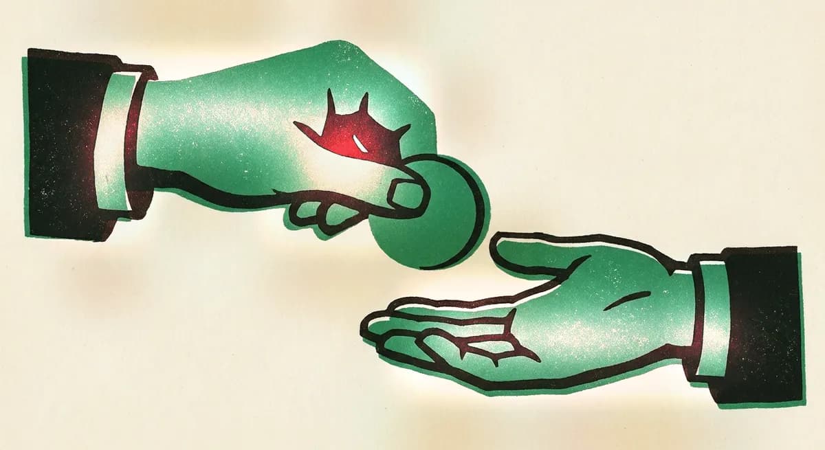 One hand passing a coin to another open hand
